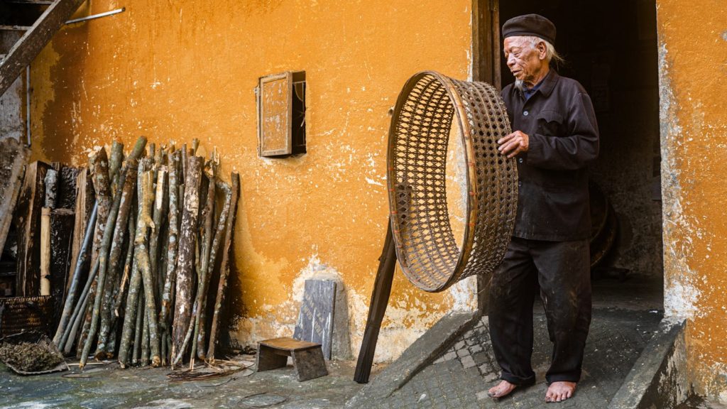 Man Holding a Wicker Circle